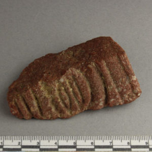 Ancient Egyptian inscribed red quartzite fragment from Amarna dated 1550 – 1295 BC