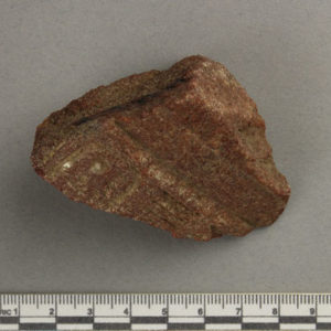 Ancient Egyptian inscribed red quartzite fragment from Amarna dated 1550 – 1295 BC