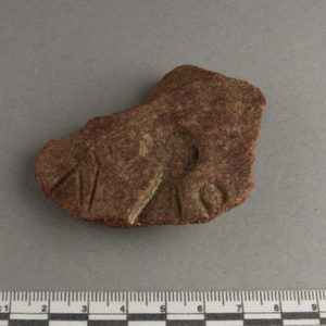 Ancient Egyptian decorated red quartzite fragment from Amarna dated 1550 – 1295 BC