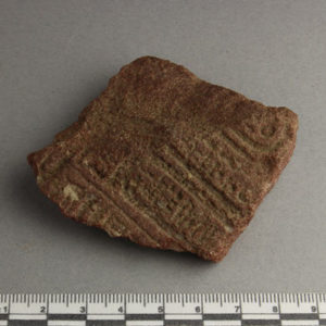 Ancient Egyptian inscribed red quartzite fragment from Amarna dated 1550 – 1295 BC