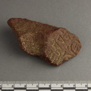 Ancient Egyptian inscribed red quartzite fragment from Amarna dated 1550 – 1295 BC