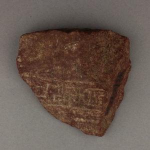 Ancient Egyptian inscribed red quartzite fragment from Amarna dated 1550 – 1295 BC