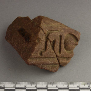 Ancient Egyptian inscribed red quartzite fragment from Amarna dated 1550 – 1295 BC