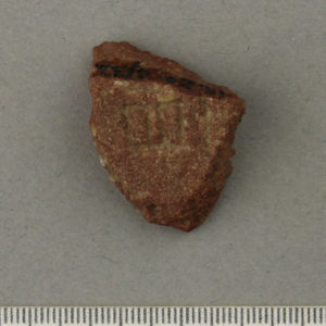 Ancient Egyptian inscribed red quartzite fragment from Amarna dated 1550 – 1295 BC