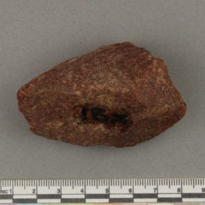 Ancient Egyptian inscribed red quartzite fragment from Amarna dated 1550 – 1295 BC