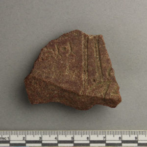 Ancient Egyptian inscribed red quartzite fragment from Amarna dated 1550 – 1295 BC