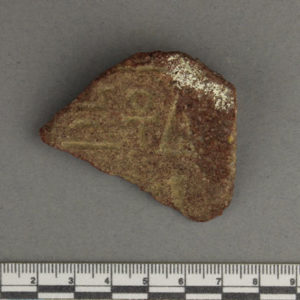 Ancient Egyptian inscribed red quartzite fragment from Amarna dated 1550 – 1295 BC