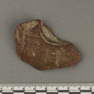 Ancient Egyptian inscribed red quartzite fragment from Amarna dated 1550 – 1295 BC