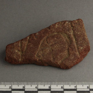 Ancient Egyptian decorated red quartzite fragment from Amarna dated 1550 – 1295 BC