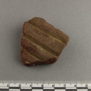 Ancient Egyptian decorated red quartzite fragment from Amarna dated 1550 – 1295 BC