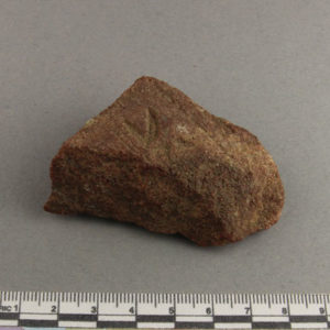 Ancient Egyptian inscribed red quartzite fragment from Amarna dated 1550 – 1295 BC