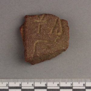 Ancient Egyptian inscribed red quartzite fragment from Amarna dated 1550 – 1295 BC