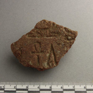 Ancient Egyptian inscribed red quartzite fragment from Amarna dated 1550 – 1295 BC