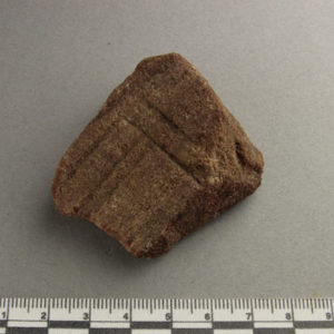 Ancient Egyptian decorated red quartzite fragment from Amarna dated 1550 – 1295 BC