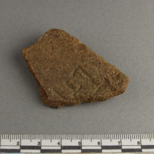 Ancient Egyptian inscribed red quartzite fragment from Amarna dated 1550 – 1295 BC