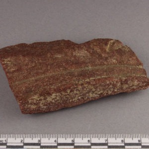 Ancient Egyptian inscribed red quartzite fragment from Amarna dated 1550 – 1295 BC