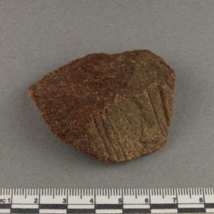 Ancient Egyptian decorated red quartzite fragment from Amarna dated 1550 – 1295 BC