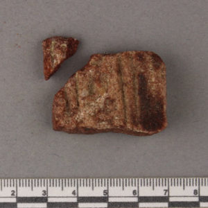 Ancient Egyptian inscribed red quartzite fragment from Amarna dated 1550 – 1295 BC