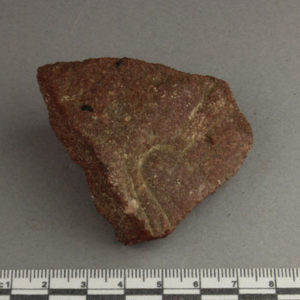 Ancient Egyptian decorated red quartzite fragment from Amarna dated 1550 – 1295 BC