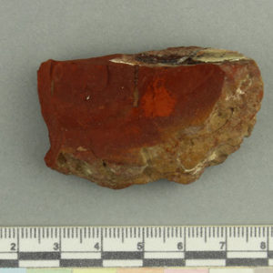 Ancient Egyptian dark red pigment fragment from Amarna dated 1550 – 1295 BC